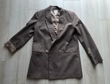 Brown houndstooth double breasted blazer, laid flat